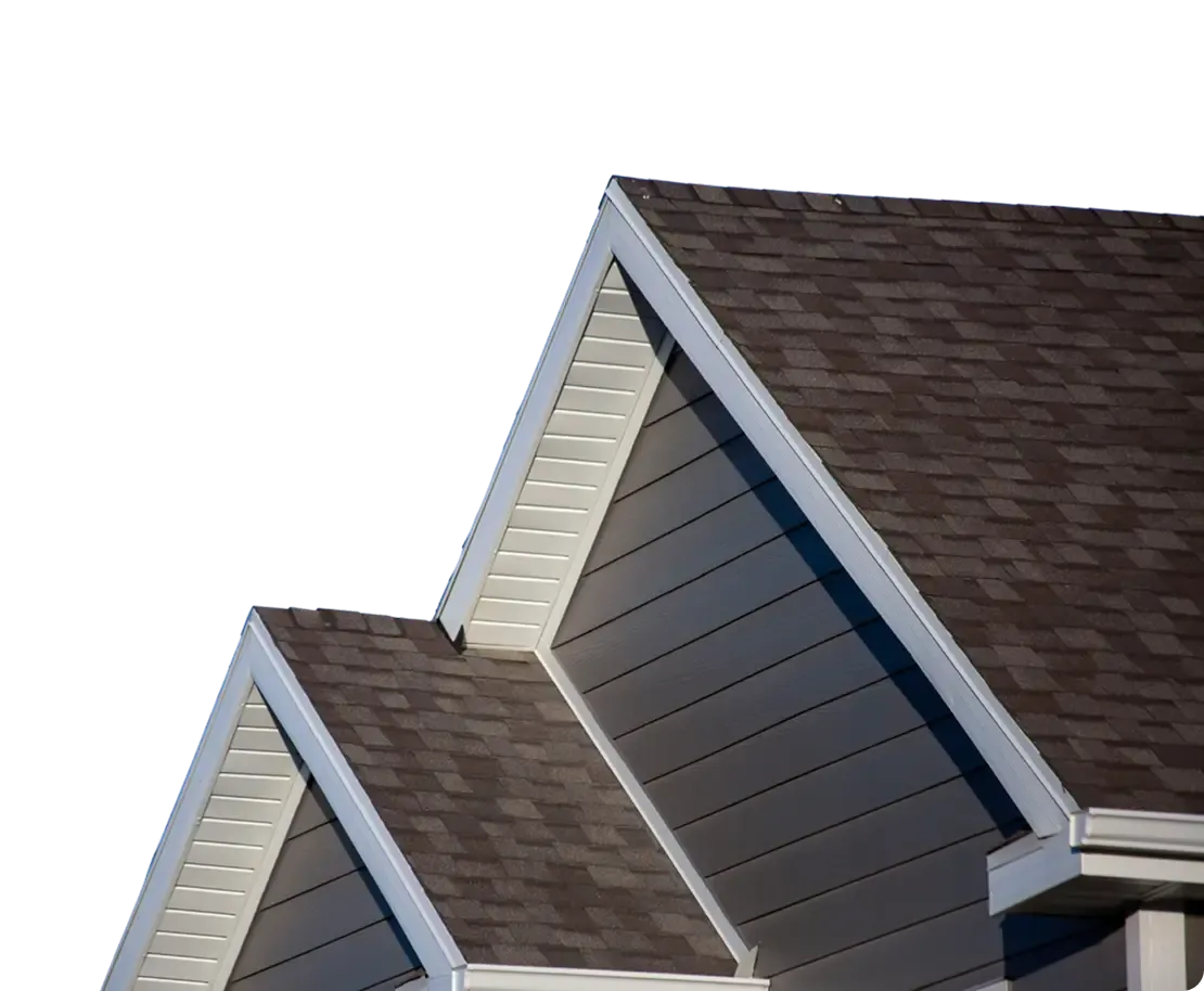 A close up of a gray house with new siding, white fascia, and brown shingle roof.