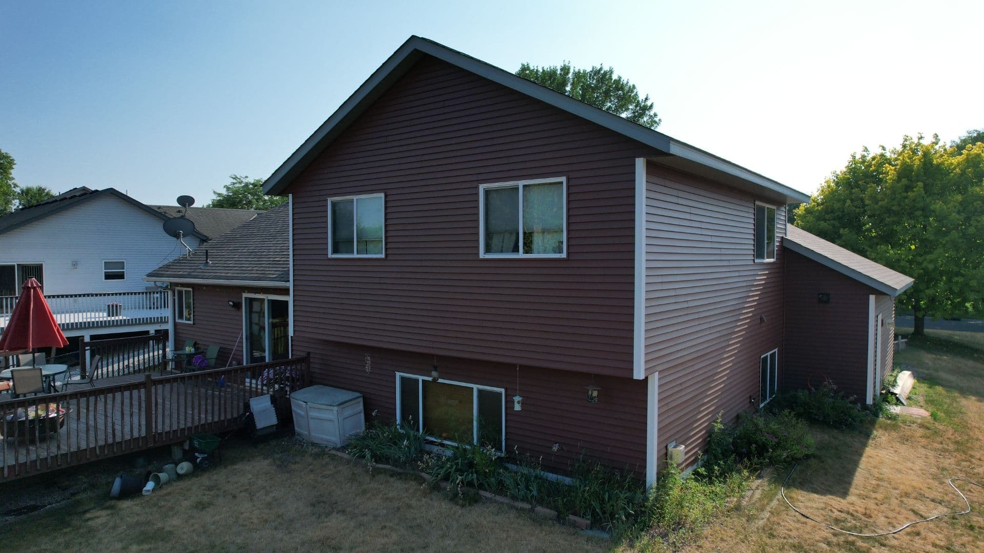A house with new dark brown siding.