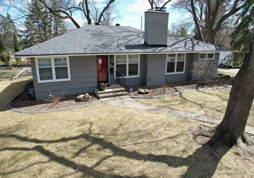 Hopkins Home Transformation: Roof, Siding, and Door Update