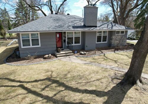 Hopkins Home Transformation: Roof, Siding, and Door Update