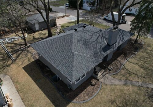 Hopkins Home Transformation: Roof, Siding, and Door Update